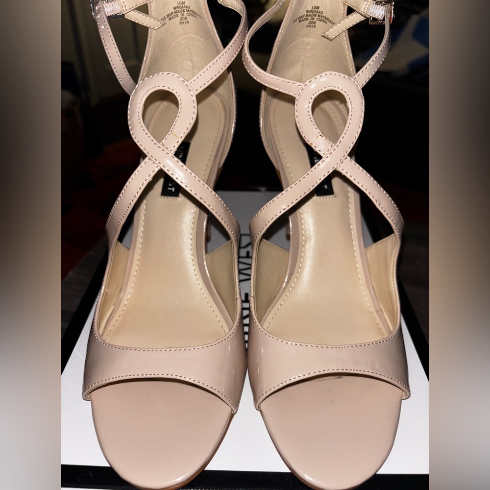 The Nine West Women's Tulah3 Ankle Strap Sandal Heels in Creme